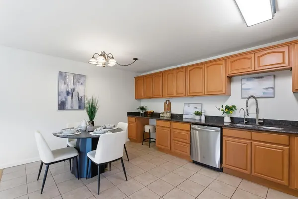 a kitchen with a sink and cabinets