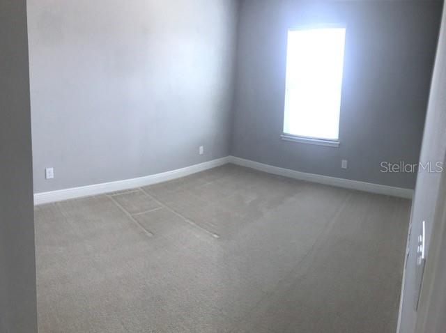 8549 Pinter Street Orlando, FL 32827 - Photo 13 of 25 an empty room with a window