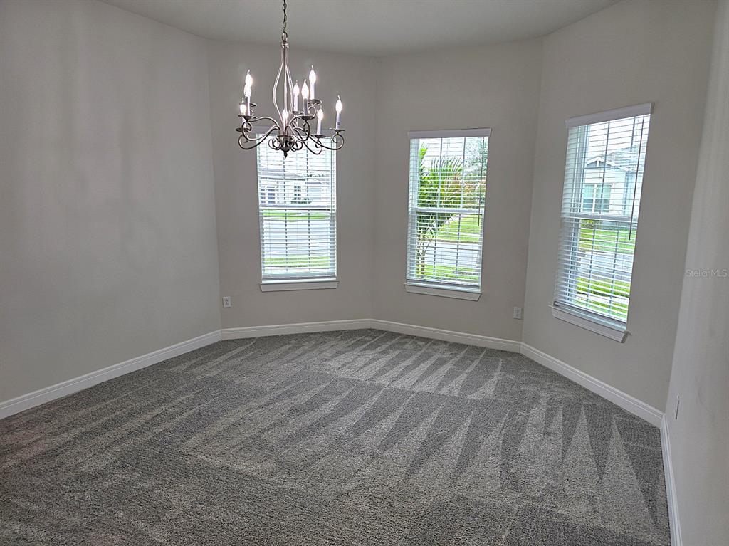 6349 Mossy Oak Road St. Cloud, FL 34771 - Photo 16 of 82 a view of an empty room with windows