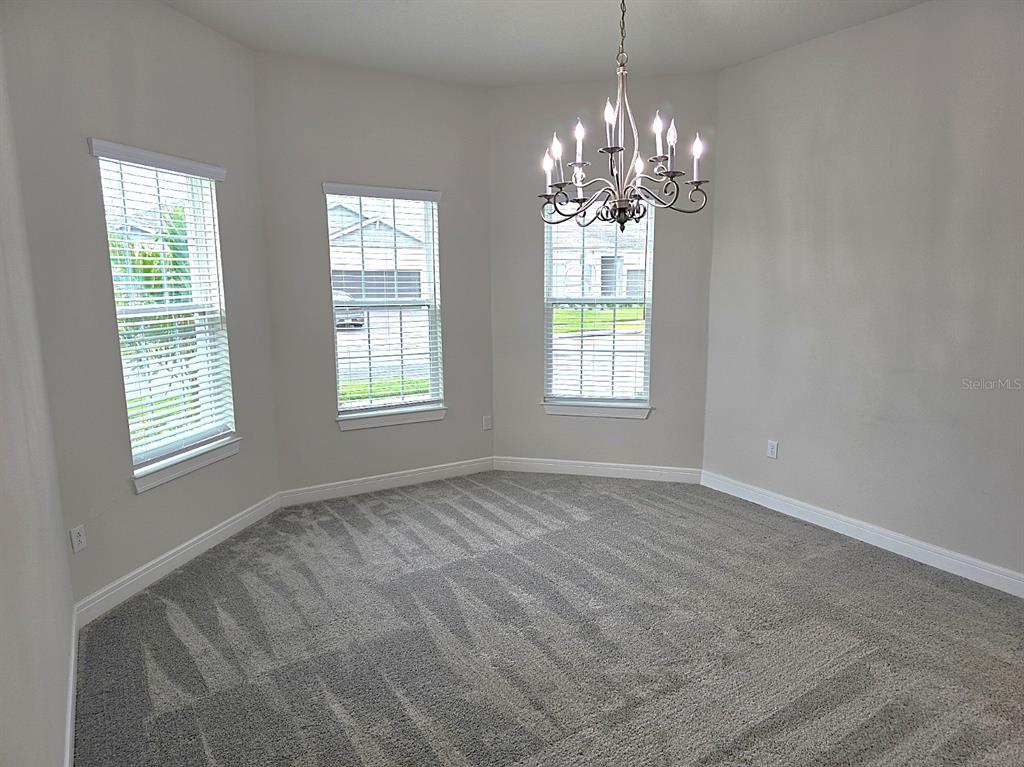 6349 Mossy Oak Road St. Cloud, FL 34771 - Photo 17 of 82 a view of an empty room with window