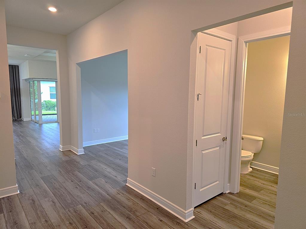 6349 Mossy Oak Road St. Cloud, FL 34771 - Photo 22 of 82 a view of a bathroom with wooden floor