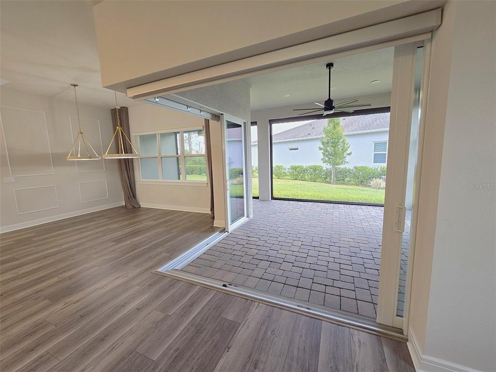 6349 Mossy Oak Road St. Cloud, FL 34771 - Photo 28 of 82 a view of empty room with wooden floor and fan