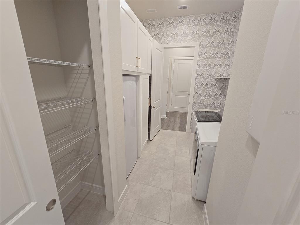 6349 Mossy Oak Road St. Cloud, FL 34771 - Photo 50 of 82 a bathroom with a shower and closet