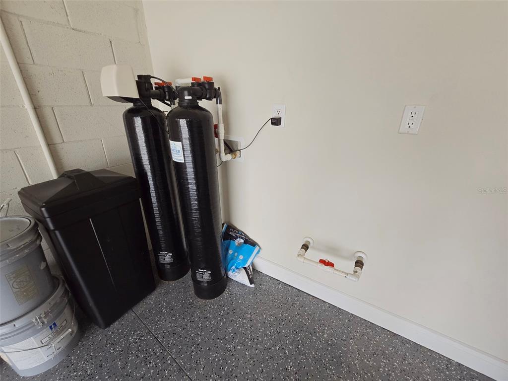 6349 Mossy Oak Road St. Cloud, FL 34771 - Photo 62 of 82 a view of walk in closet with clothes and shoes