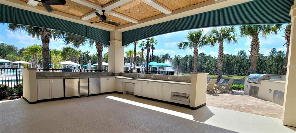 6349 Mossy Oak Road St. Cloud, FL 34771 - Photo 65 of 82 a kitchen with stainless steel appliances granite countertop a stove and white cabinets