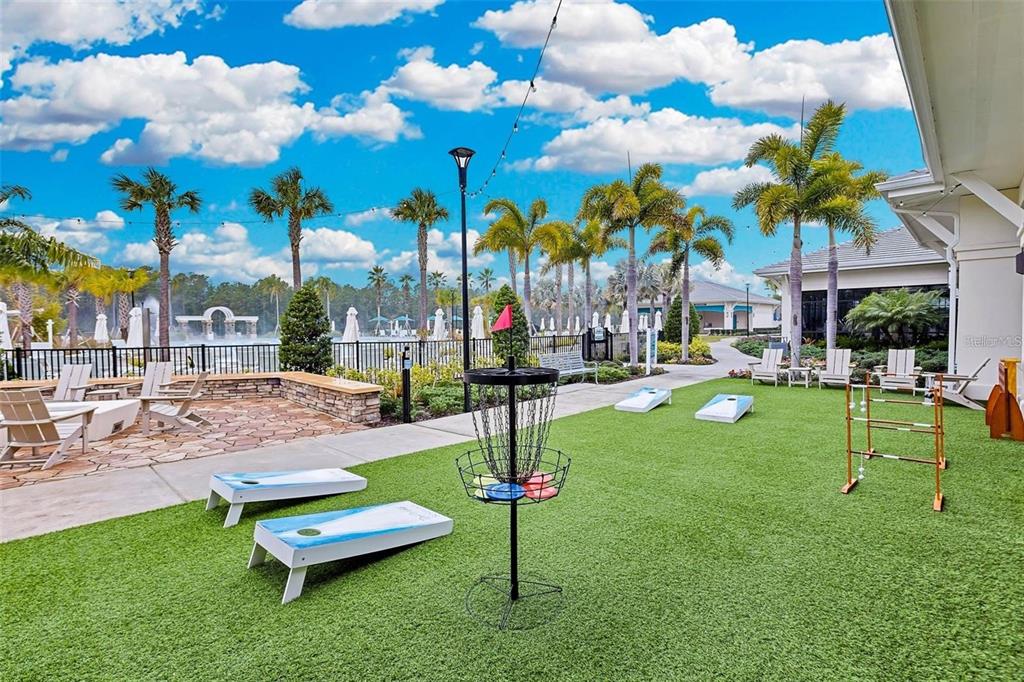 6349 Mossy Oak Road St. Cloud, FL 34771 - Photo 69 of 82 a swimming pool with outdoor seating yard and slide