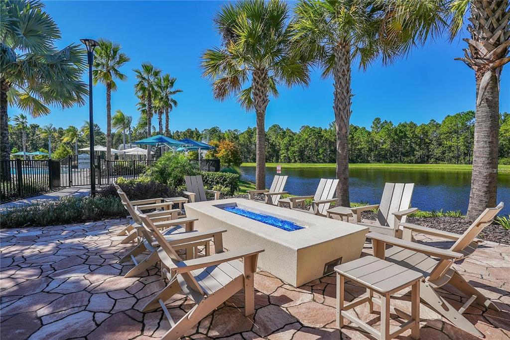 6349 Mossy Oak Road St. Cloud, FL 34771 - Photo 70 of 82 a view of a patio with swimming pool table and chairs