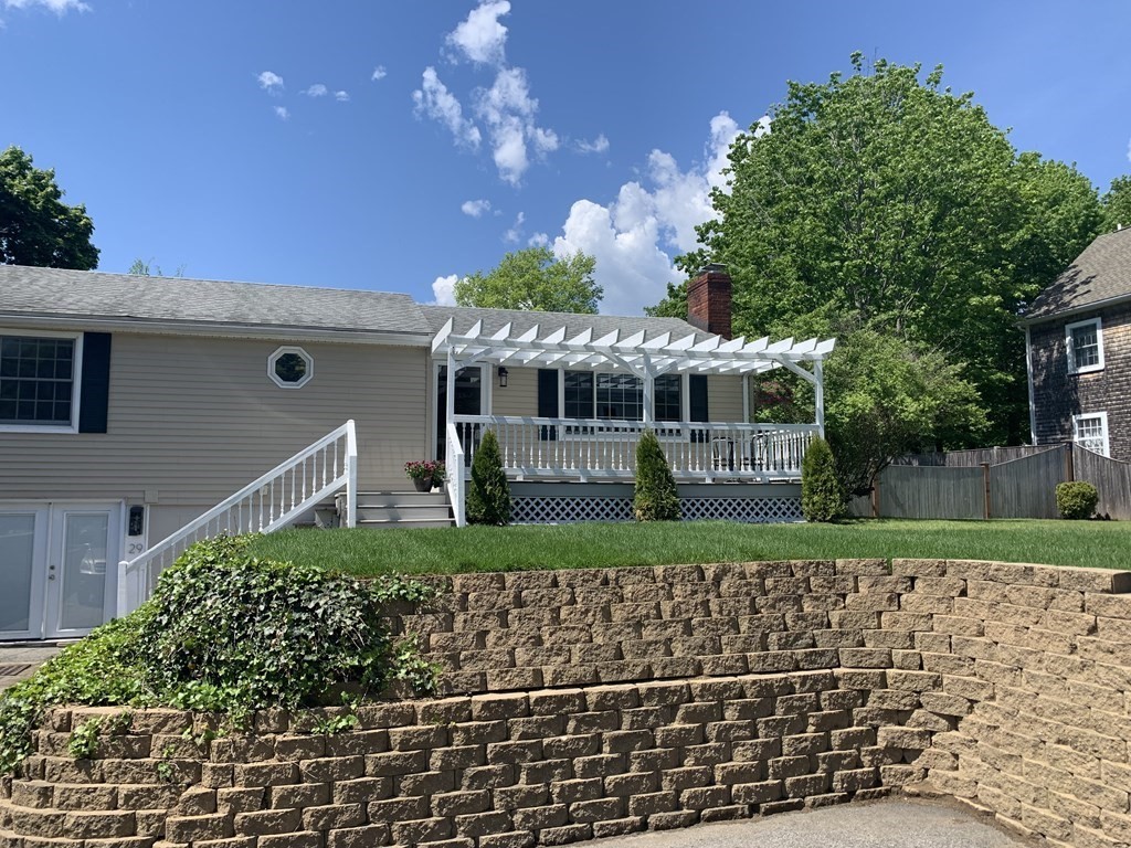 29 Bridge Street Hamilton, MA 01982 - Photo 1 of 16 a front view of a house with a yard