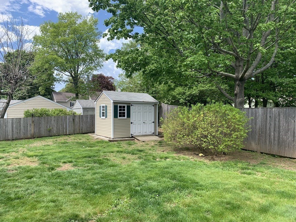 29 Bridge Street Hamilton, MA 01982 - Photo 15 of 16 a view of a house with a yard and large trees