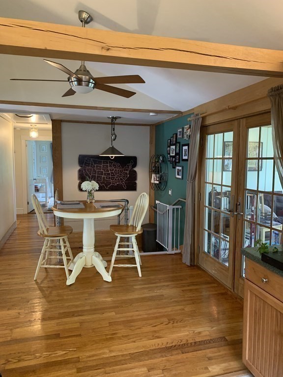 29 Bridge Street Hamilton, MA 01982 - Photo 7 of 16 a view of a dining room with furniture wooden floor and a chandelier