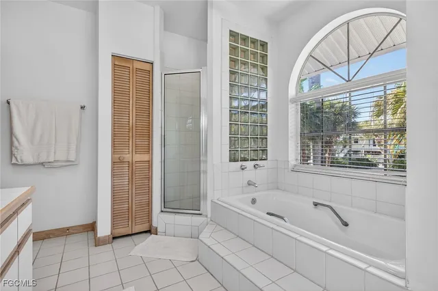 a bathroom with a bathtub and a shower