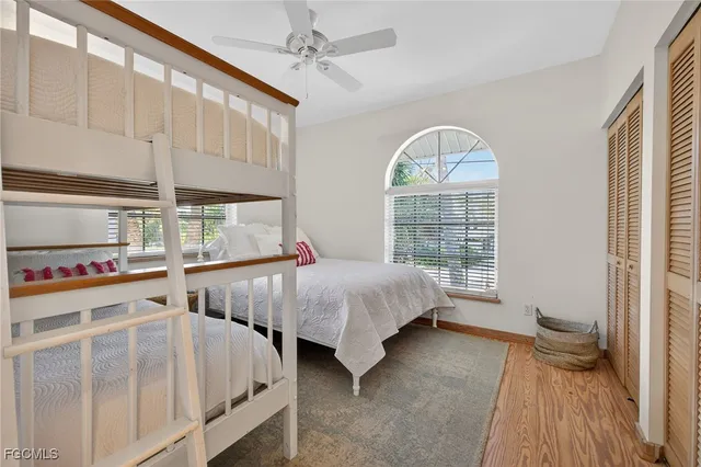 a spacious bedroom with two beds and a window