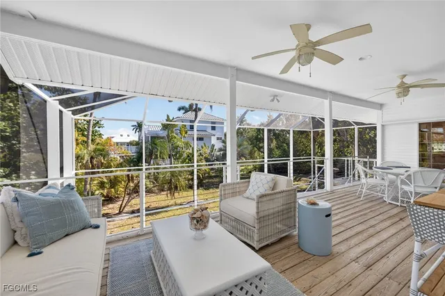 a living room with couch a large window with outer view