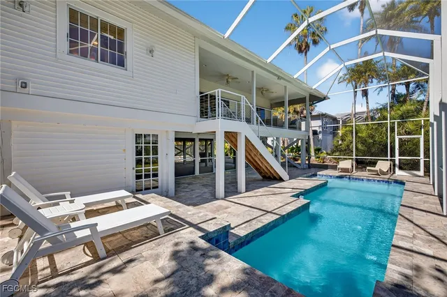 a view of a patio with a table and chairs