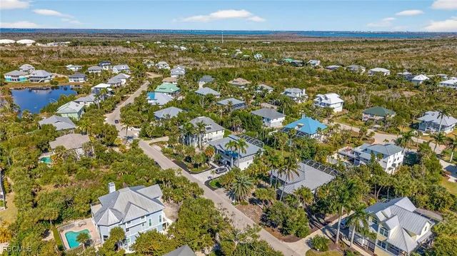 an aerial view of residential building and trees