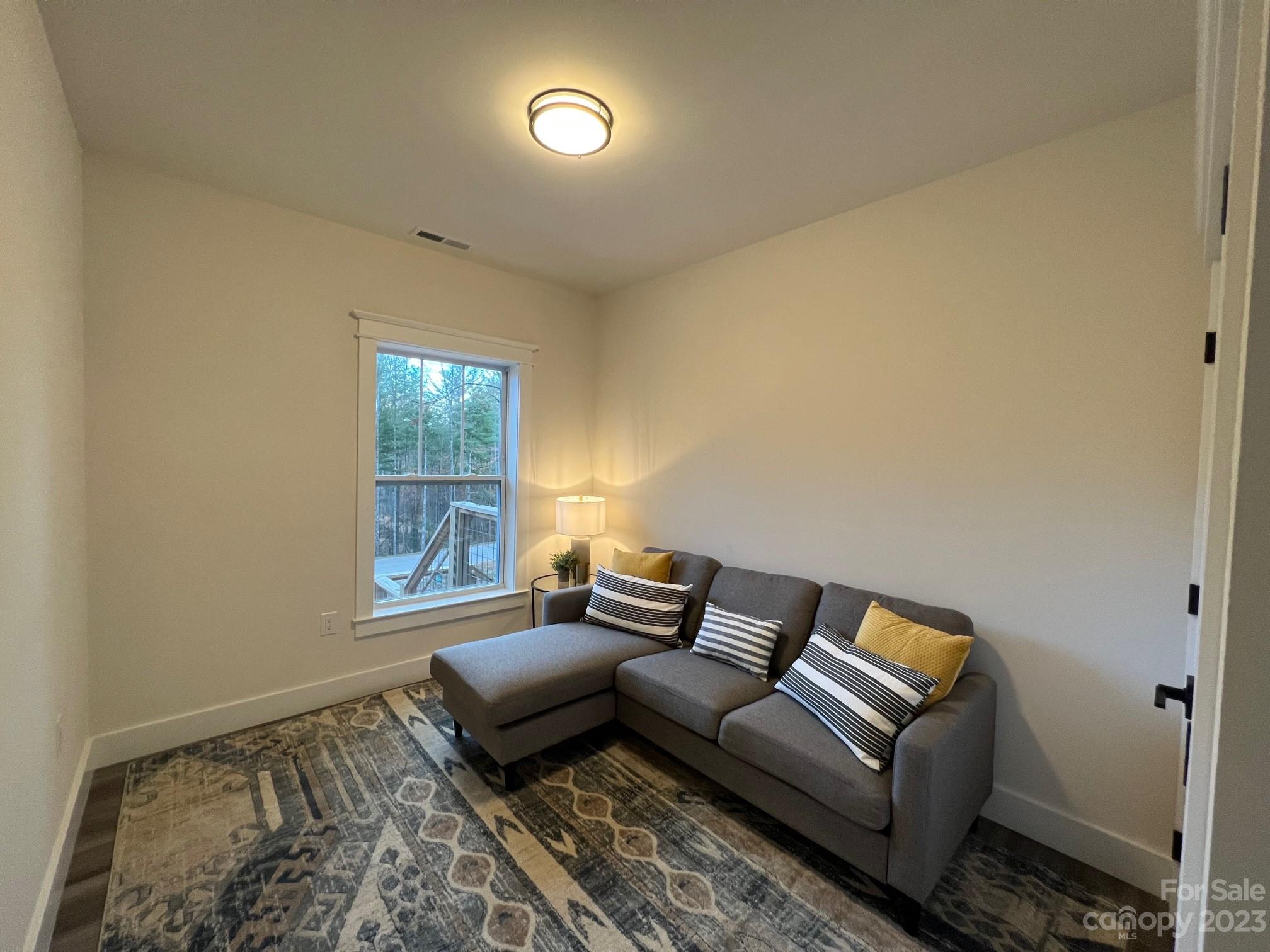 152 Cascade Rdg Road Fairview, NC 28730 - Photo 14 of 18 a living room with furniture and a window