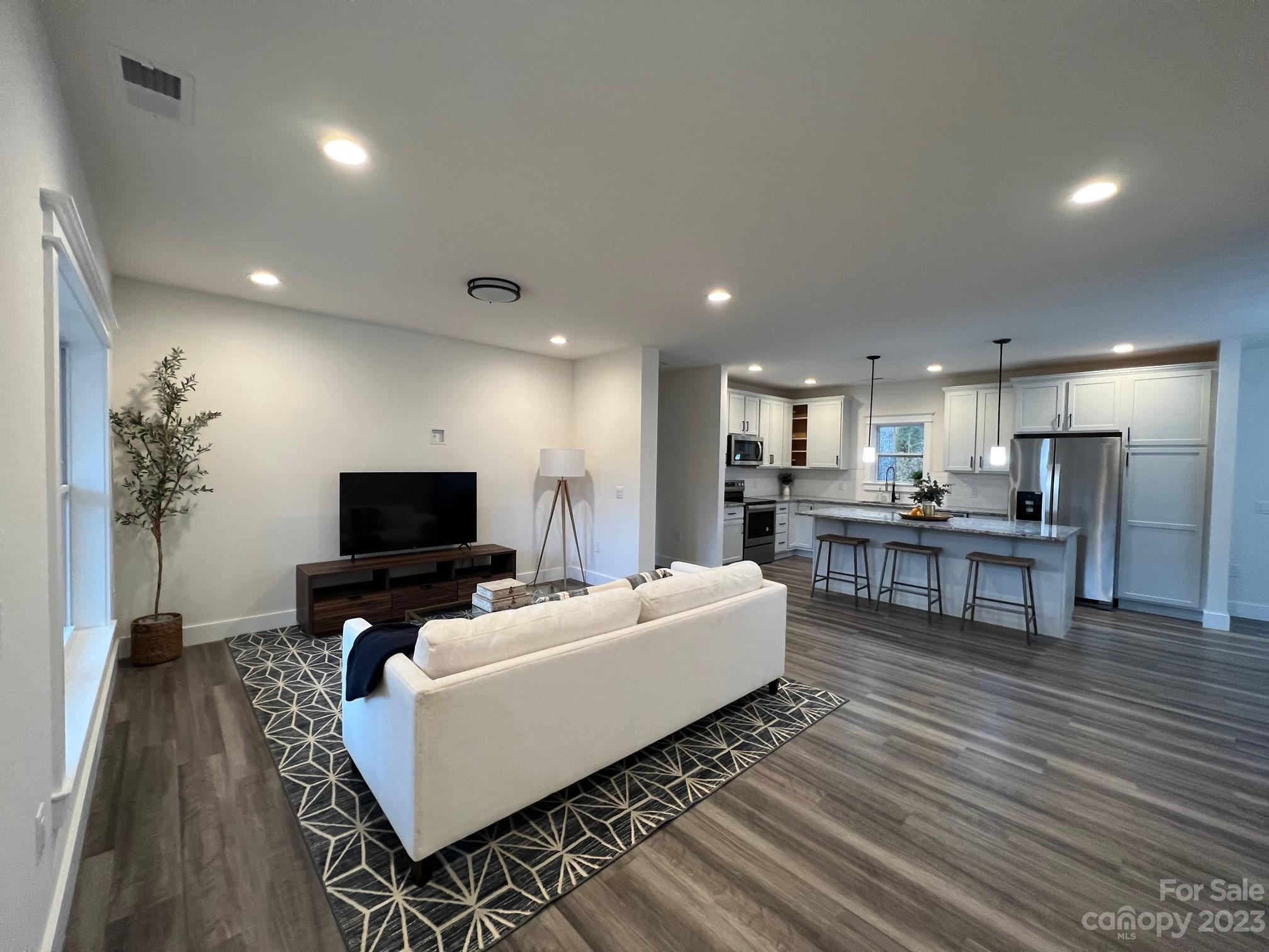 152 Cascade Rdg Road Fairview, NC 28730 - Photo 5 of 18 a living room with furniture and a flat screen tv