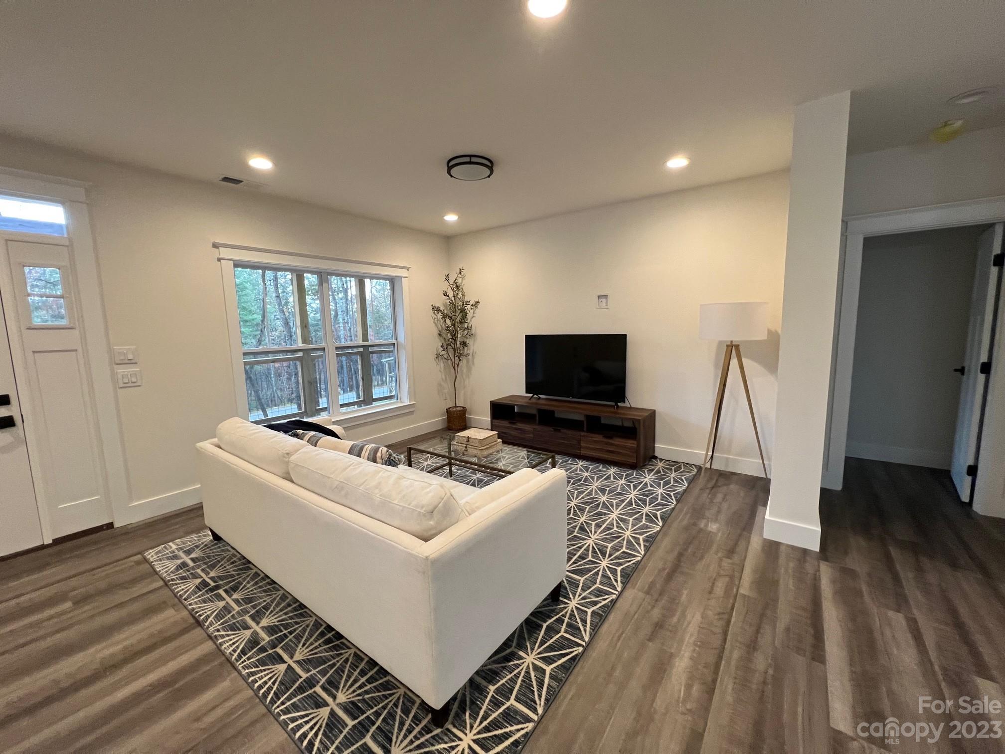 152 Cascade Rdg Road Fairview, NC 28730 - Photo 6 of 18 a living room with furniture and a flat screen tv