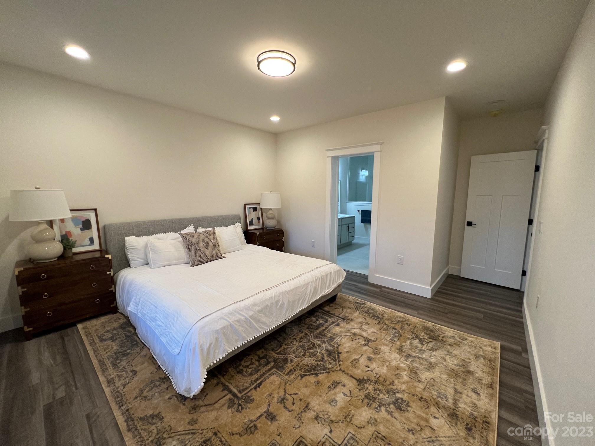 152 Cascade Rdg Road Fairview, NC 28730 - Photo 9 of 18 a bedroom with a bed and a walk in closet