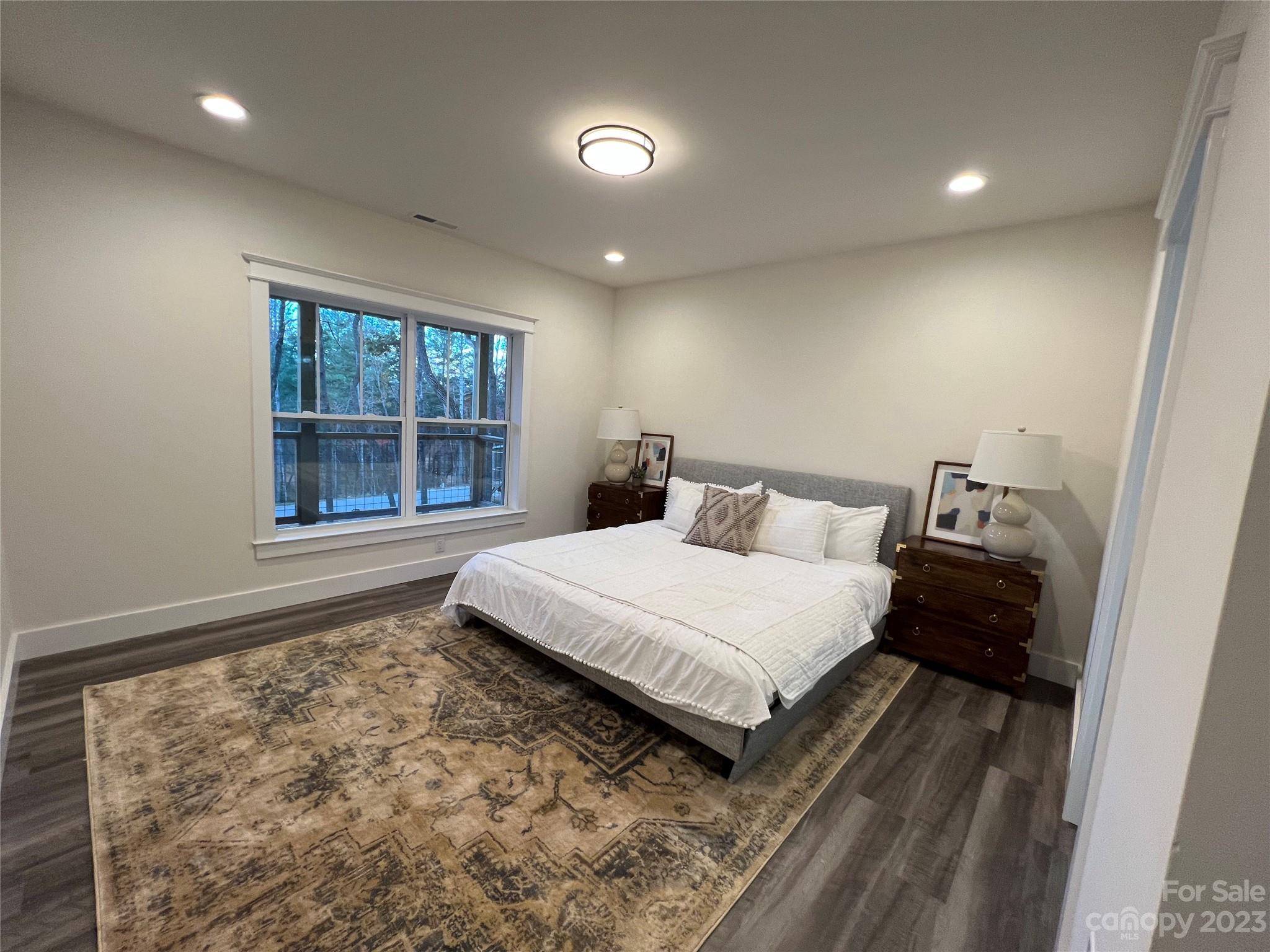 152 Cascade Rdg Road Fairview, NC 28730 - Photo 10 of 18 a bedroom with a bed and a window