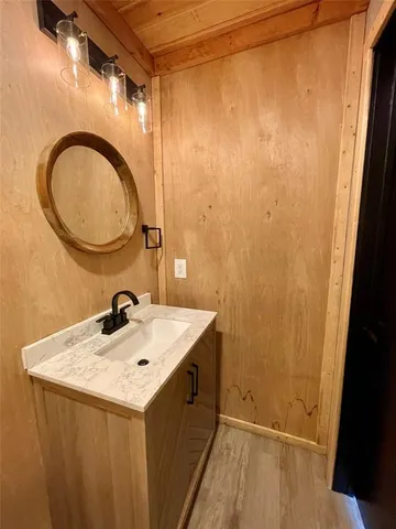 a bathroom with a sink and a mirror