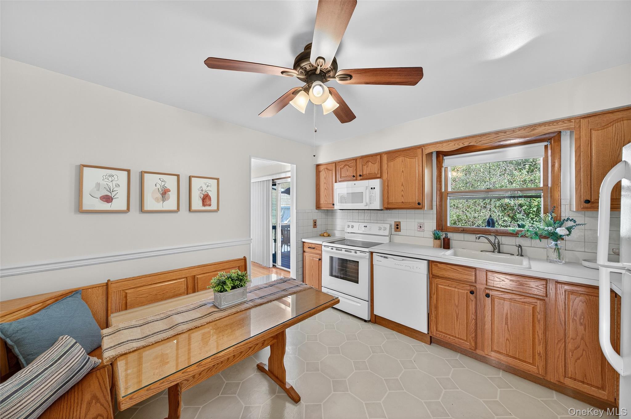 18 Rondack Road Middletown, NY 10941 - Photo 11 of 33 Kitchen featuring tasteful backsplash, white appliances, light countertops, ceiling fan, and light tile patterned flooring