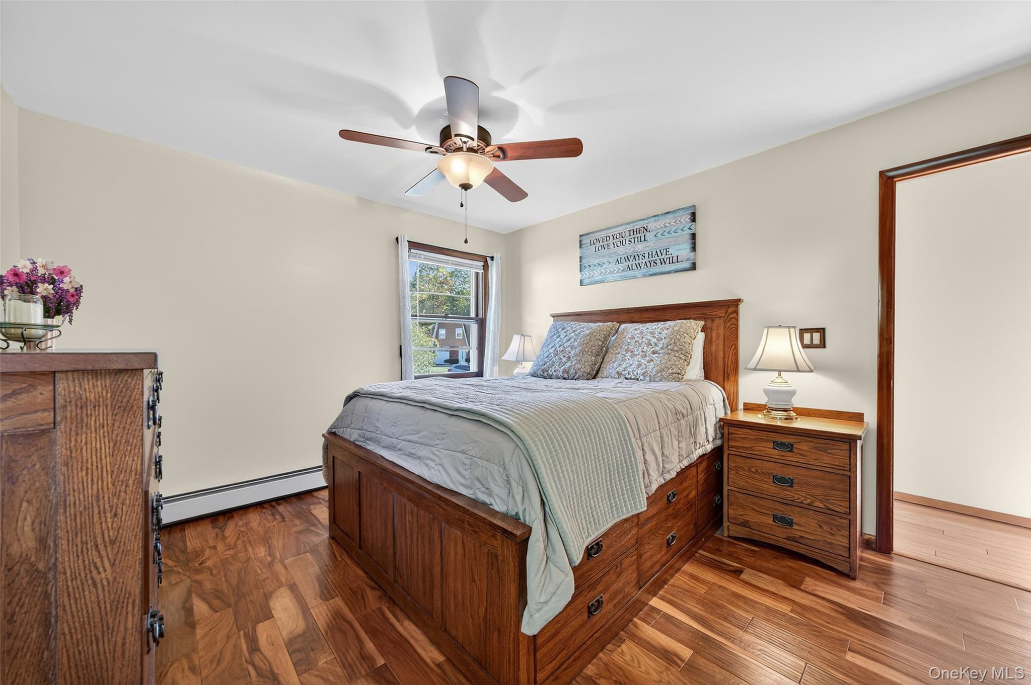 18 Rondack Road Middletown, NY 10941 - Photo 16 of 33 Bedroom featuring a baseboard radiator, wood finished floors, and a ceiling fan