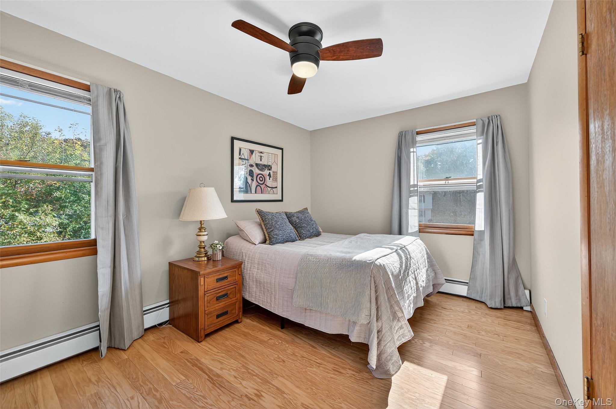 18 Rondack Road Middletown, NY 10941 - Photo 17 of 33 Bedroom with light wood finished floors, a ceiling fan, and a baseboard heating unit
