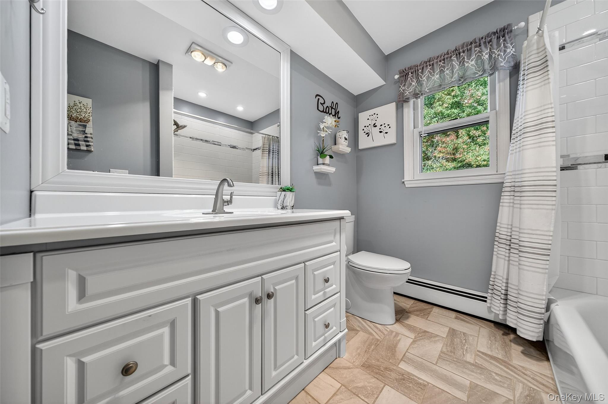 18 Rondack Road Middletown, NY 10941 - Photo 21 of 33 Bathroom with vanity, shower / tub combo with curtain, and baseboard heating