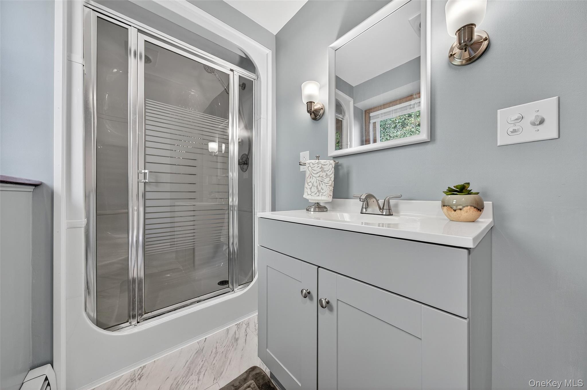 18 Rondack Road Middletown, NY 10941 - Photo 26 of 33 Bathroom with vanity, a shower stall, and light marble finish floors