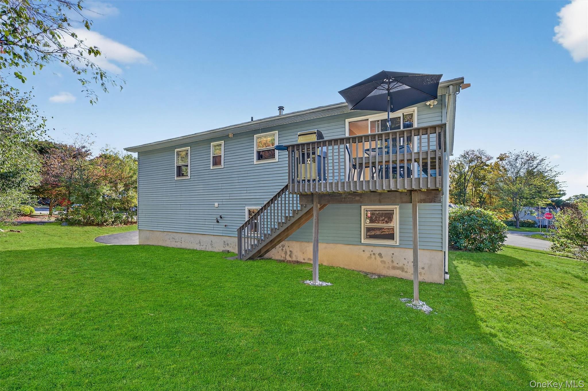 18 Rondack Road Middletown, NY 10941 - Photo 32 of 33 Back of property with a yard, stairway, and a wooden deck