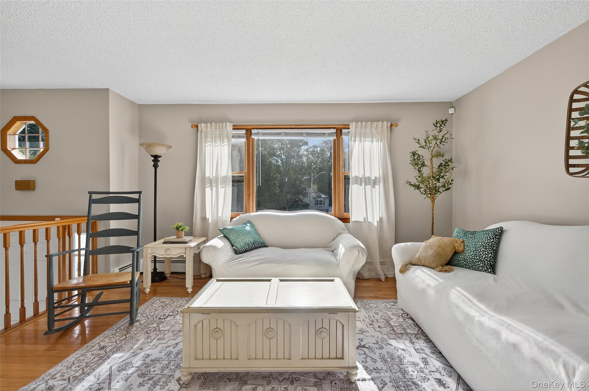 18 Rondack Road Middletown, NY 10941 - Photo 6 of 33 Living area featuring light wood finished floors and a textured ceiling