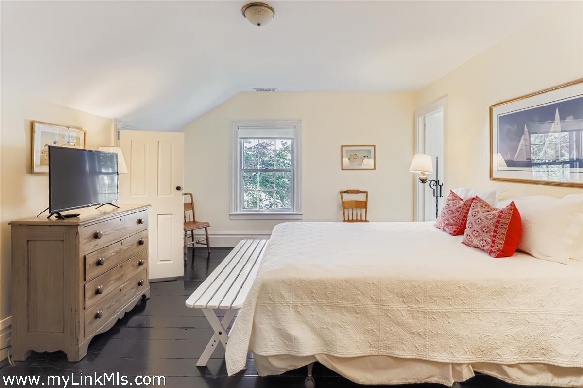 27 Spring Street Vineyard Haven, MA 02568 - Photo 46 of 58 a bedroom with a bed and a flat screen tv