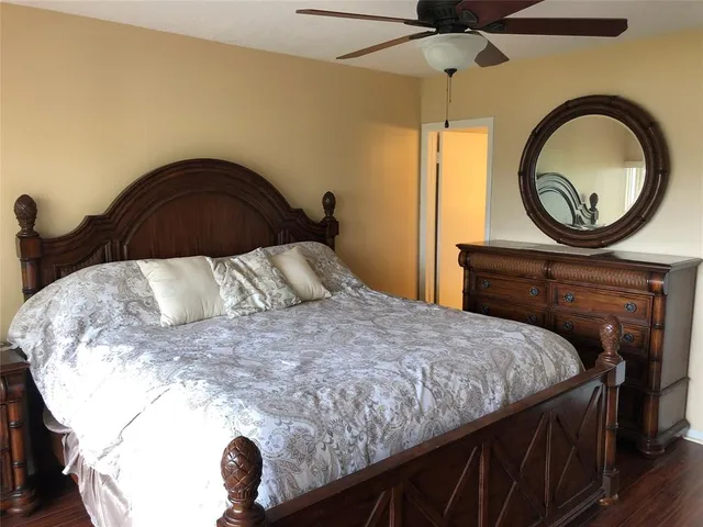 a bedroom with a bed and a dresser