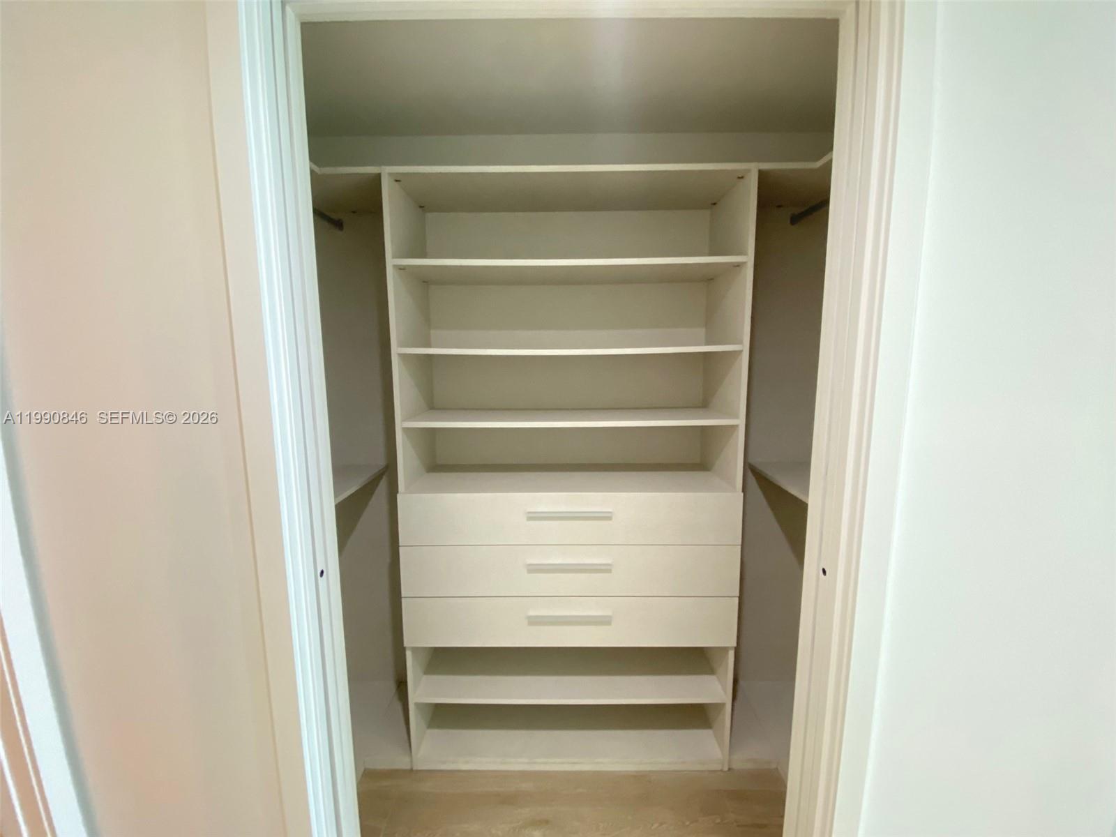 10203 Collins Avenue, Unit 905 Bal Harbour, FL 33154 - Photo 15 of 35 a view of walk in closet with empty racks