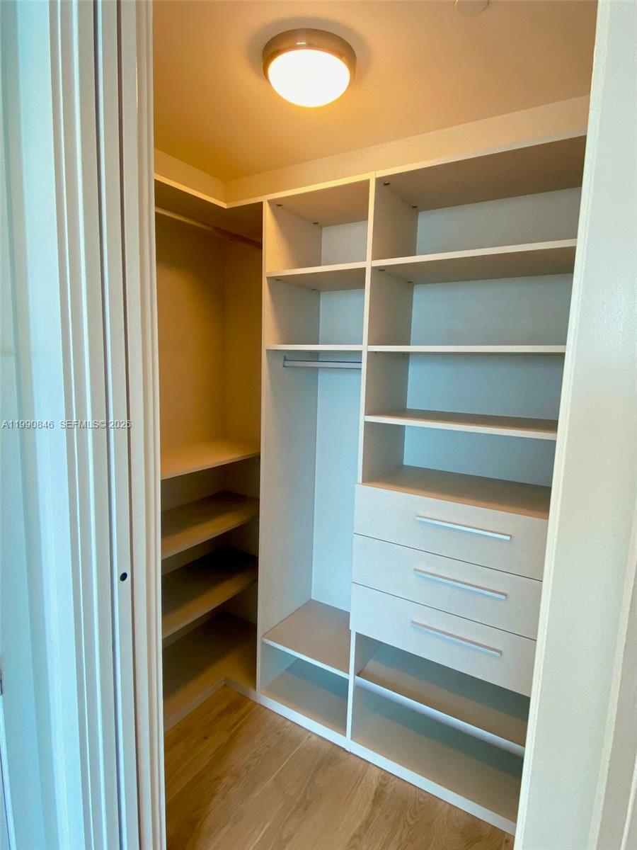 10203 Collins Avenue, Unit 905 Bal Harbour, FL 33154 - Photo 18 of 35 a view of walk in closet with empty racks
