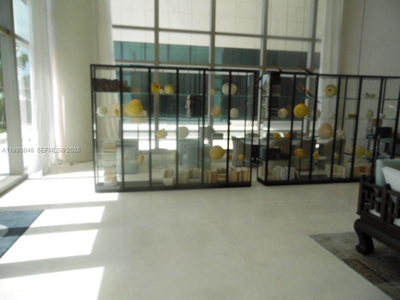 10203 Collins Avenue, Unit 905 Bal Harbour, FL 33154 - Photo 24 of 35 a view of staircase with window