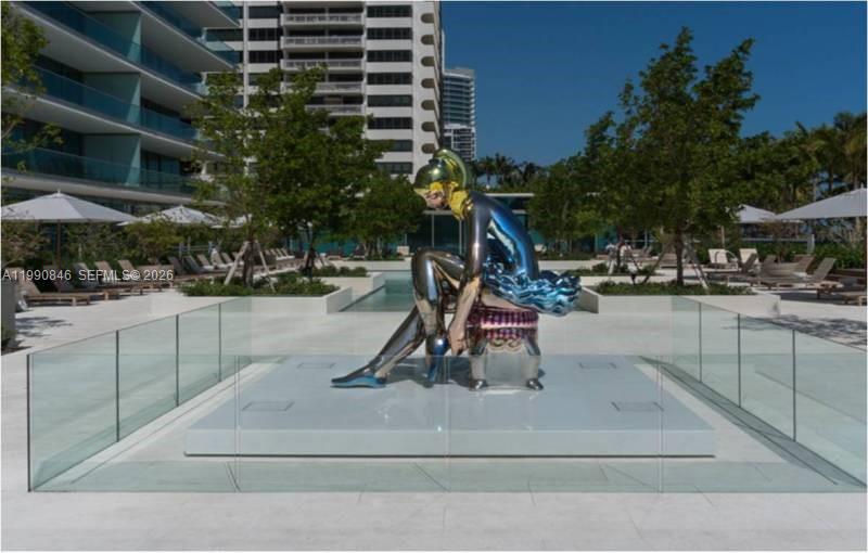 10203 Collins Avenue, Unit 905 Bal Harbour, FL 33154 - Photo 26 of 35 a park view with a bench