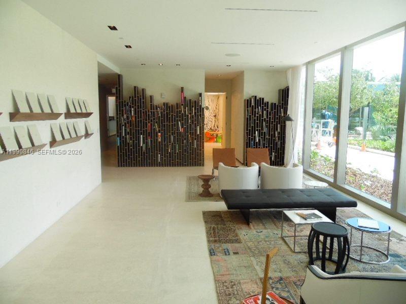 10203 Collins Avenue, Unit 905 Bal Harbour, FL 33154 - Photo 32 of 35 a living room with furniture