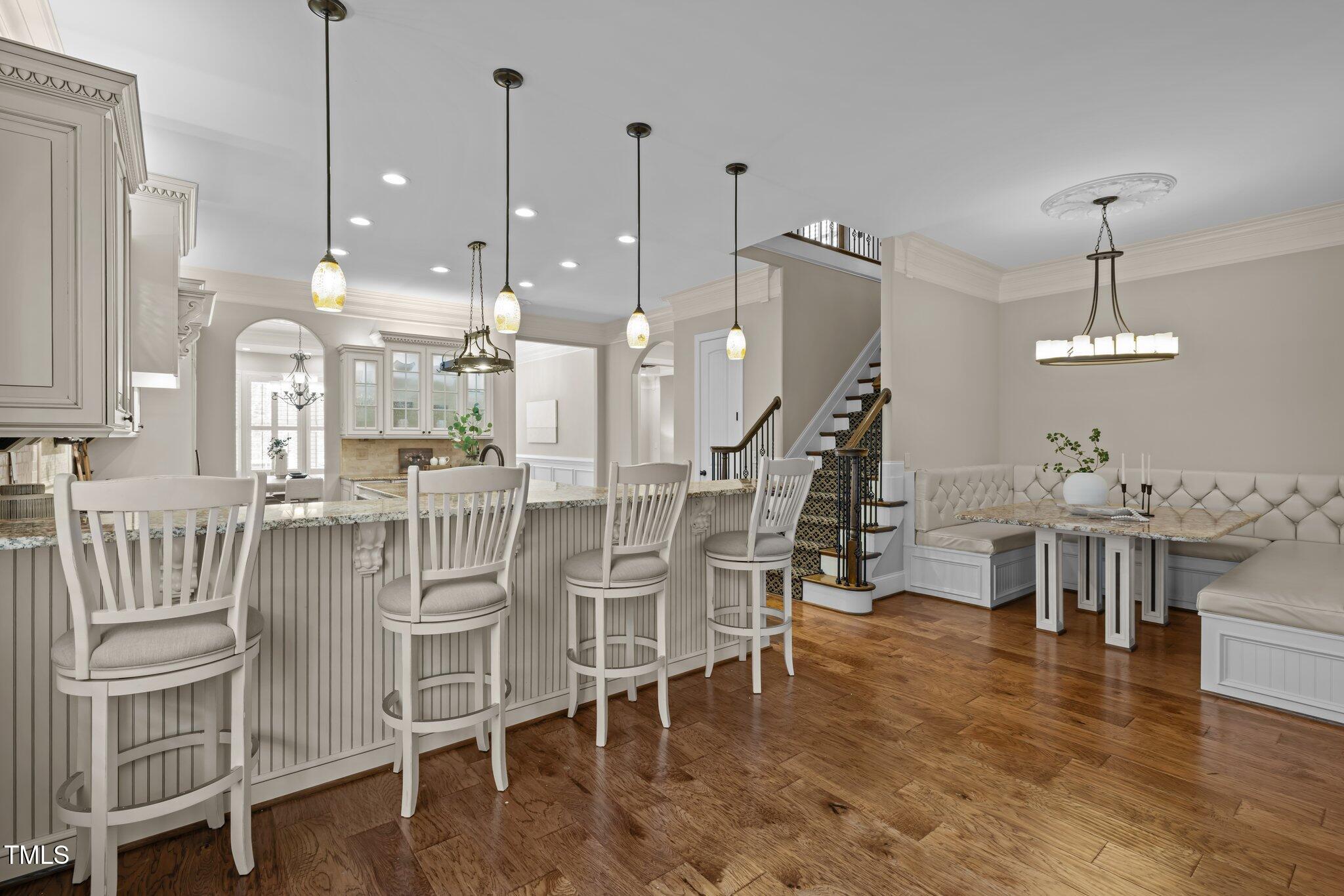 1086 Tender Drive Apex, NC 27502 - Photo 11 of 35 a large kitchen with a table and chairs