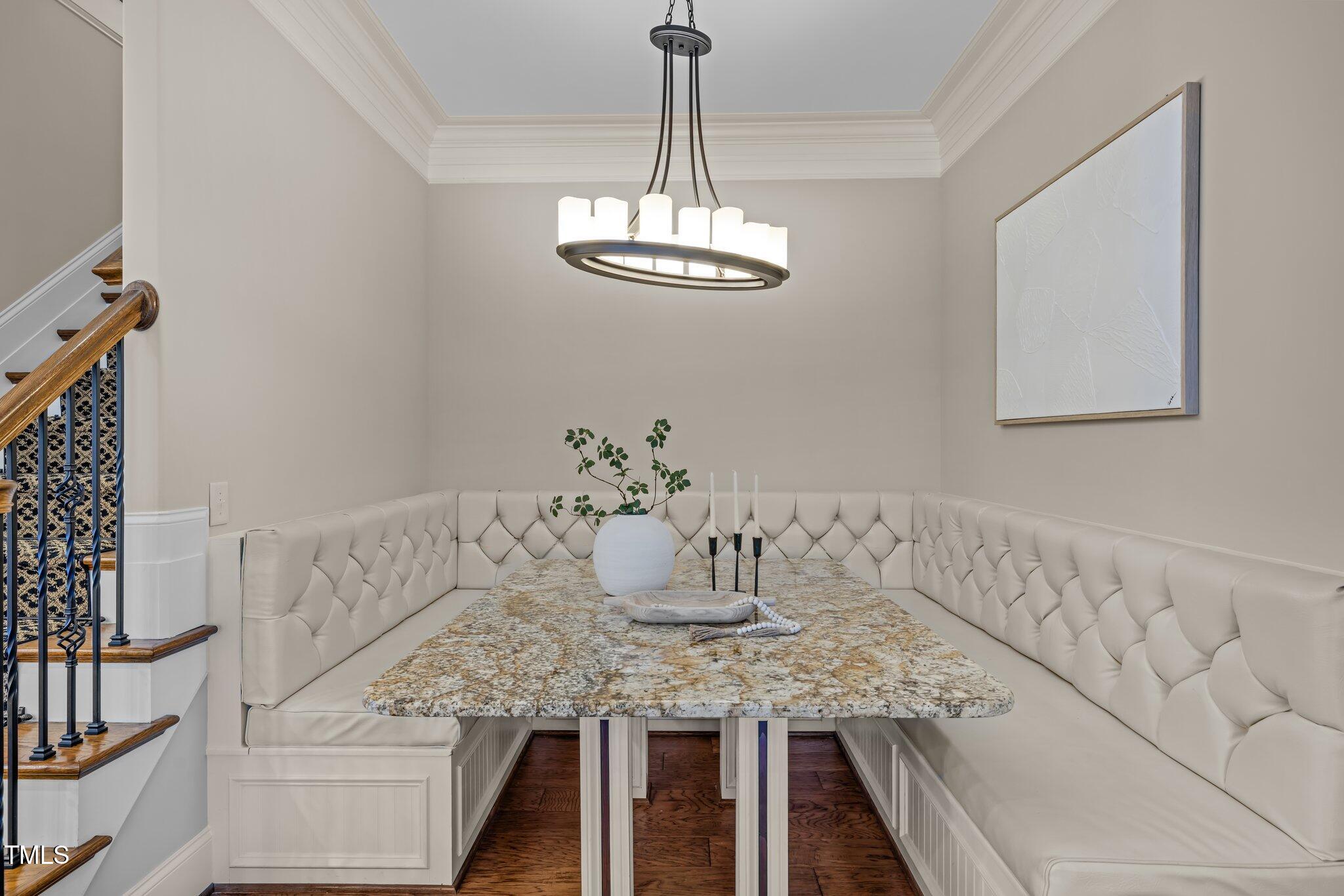 1086 Tender Drive Apex, NC 27502 - Photo 12 of 35 a view of a dining room with furniture and chandelier