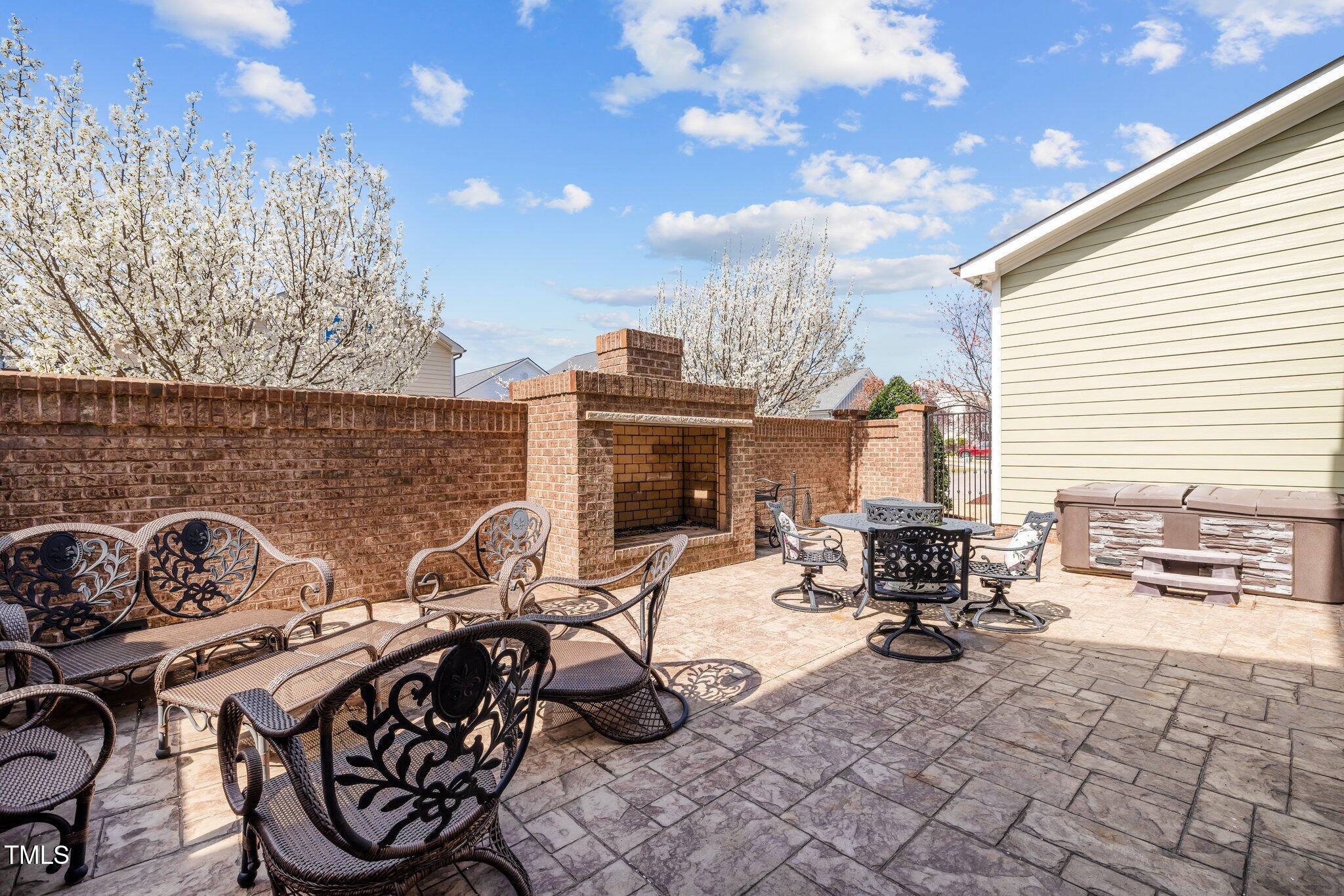 1086 Tender Drive Apex, NC 27502 - Photo 17 of 35 a view of a dinning table and chairs in the patio
