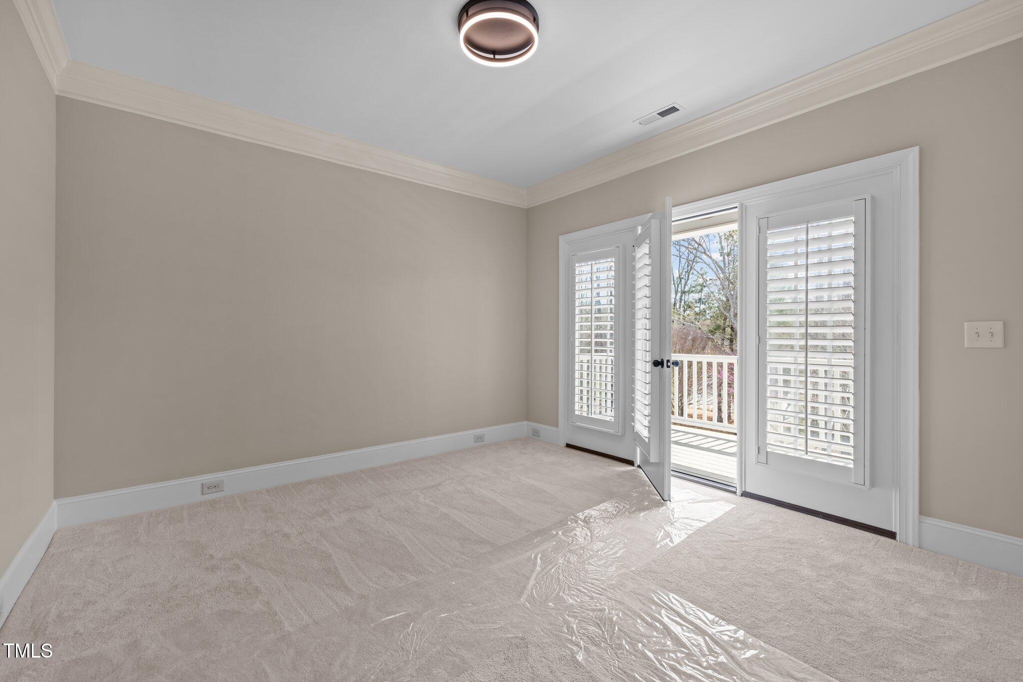 1086 Tender Drive Apex, NC 27502 - Photo 23 of 35 a view of empty room with floor to ceiling window
