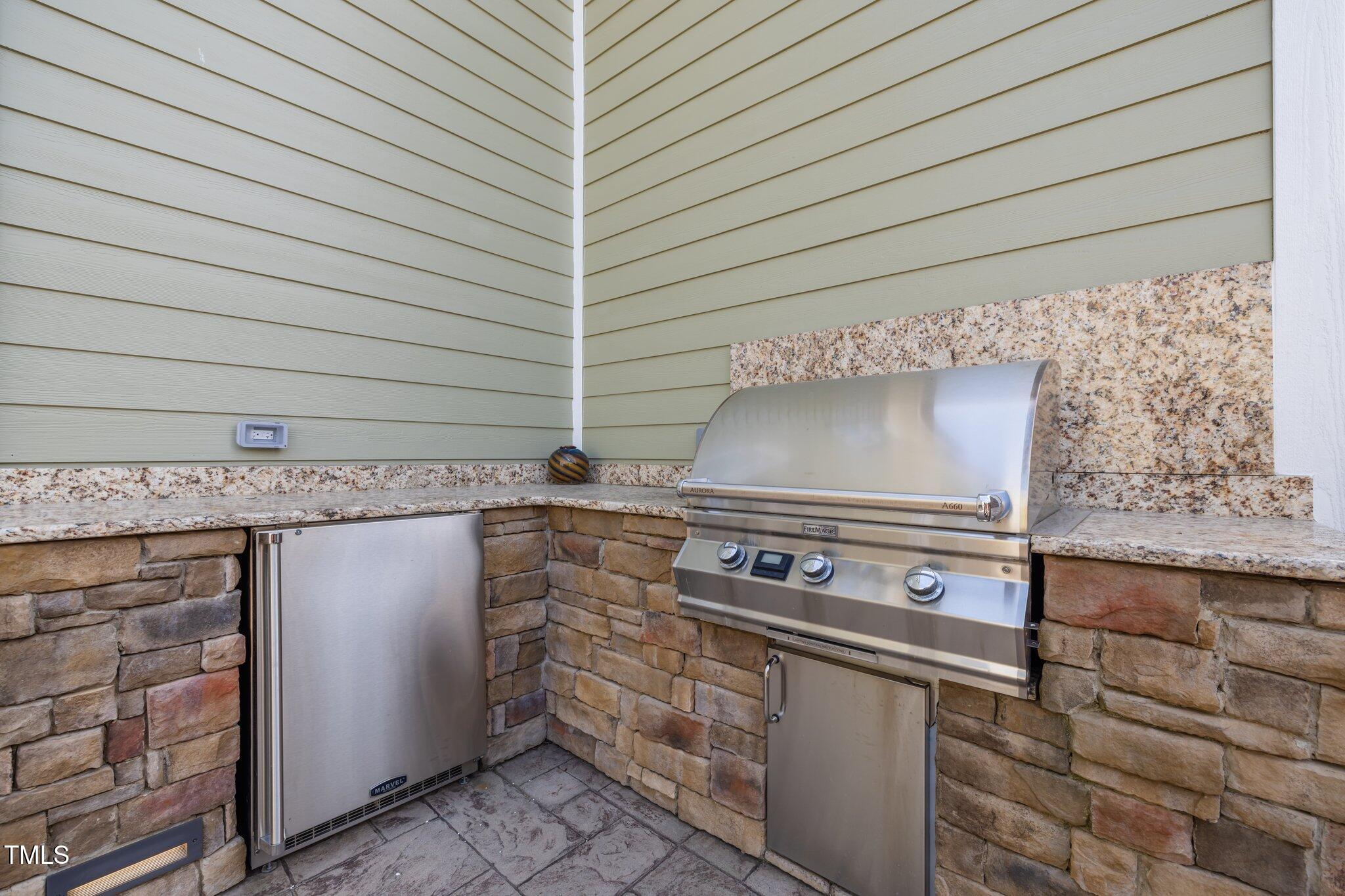 1086 Tender Drive Apex, NC 27502 - Photo 30 of 35 a stove top oven sitting inside of a kitchen