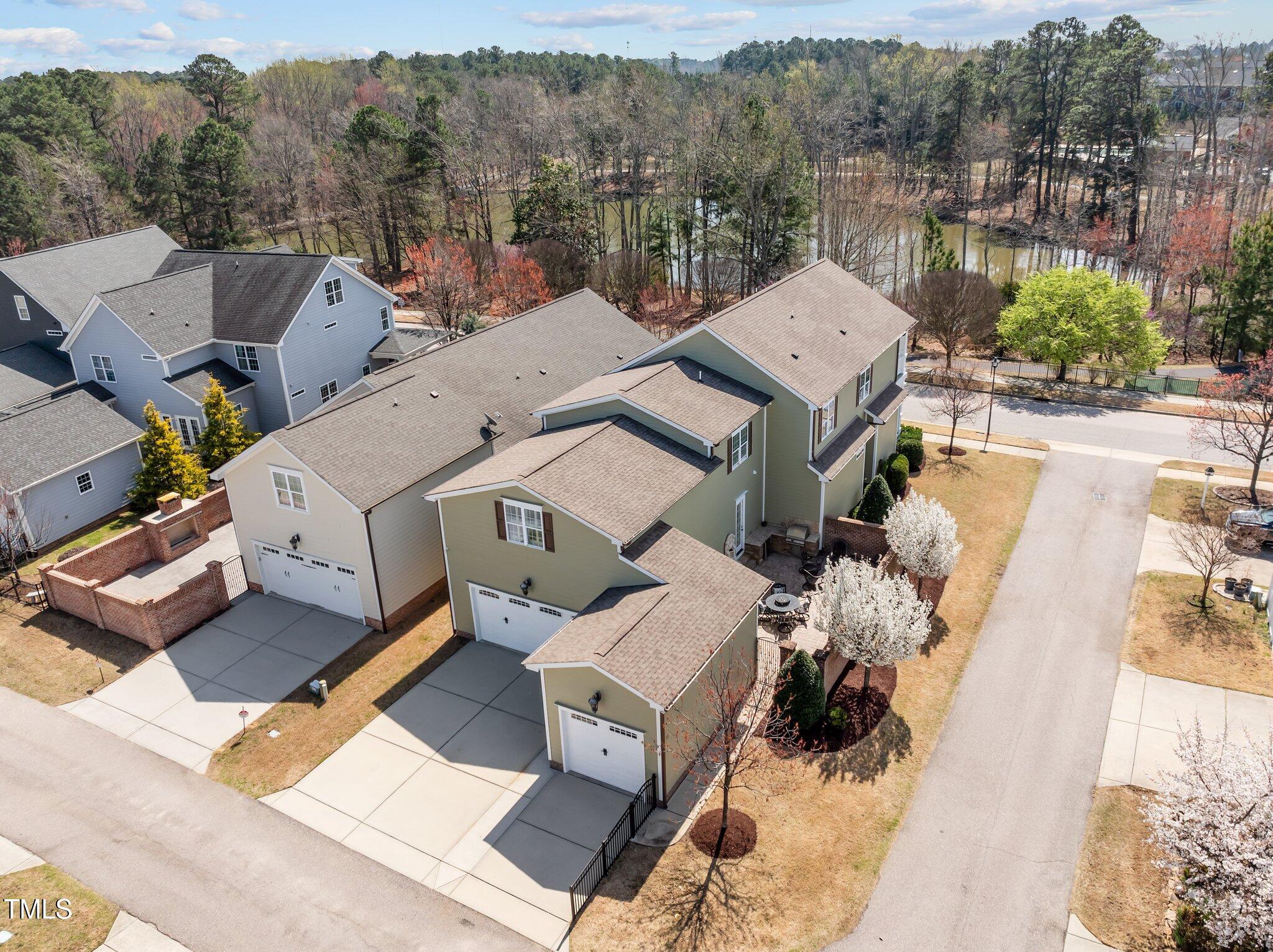 1086 Tender Drive Apex, NC 27502 - Photo 34 of 35 an aerial view of a house with a garden and mountain view