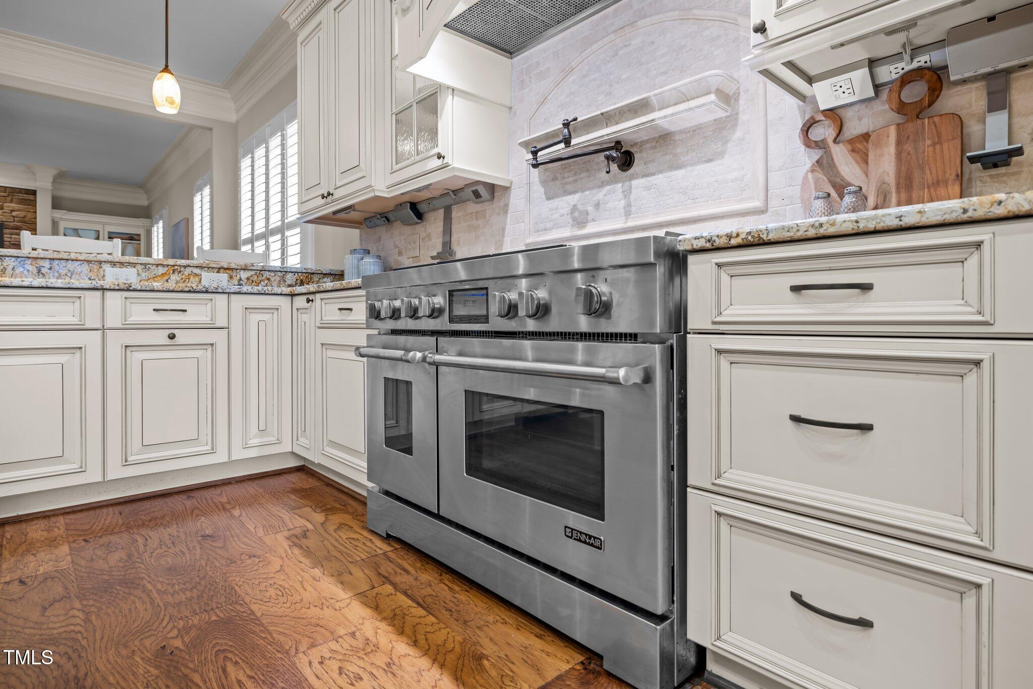 1086 Tender Drive Apex, NC 27502 - Photo 7 of 35 a stove top oven sitting inside of a kitchen