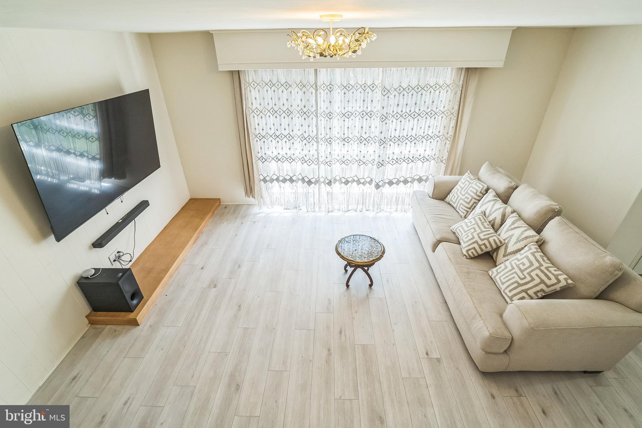 133 Lewis Road Havertown, PA 19083 - Photo 11 of 33 a living room with furniture and a flat screen tv