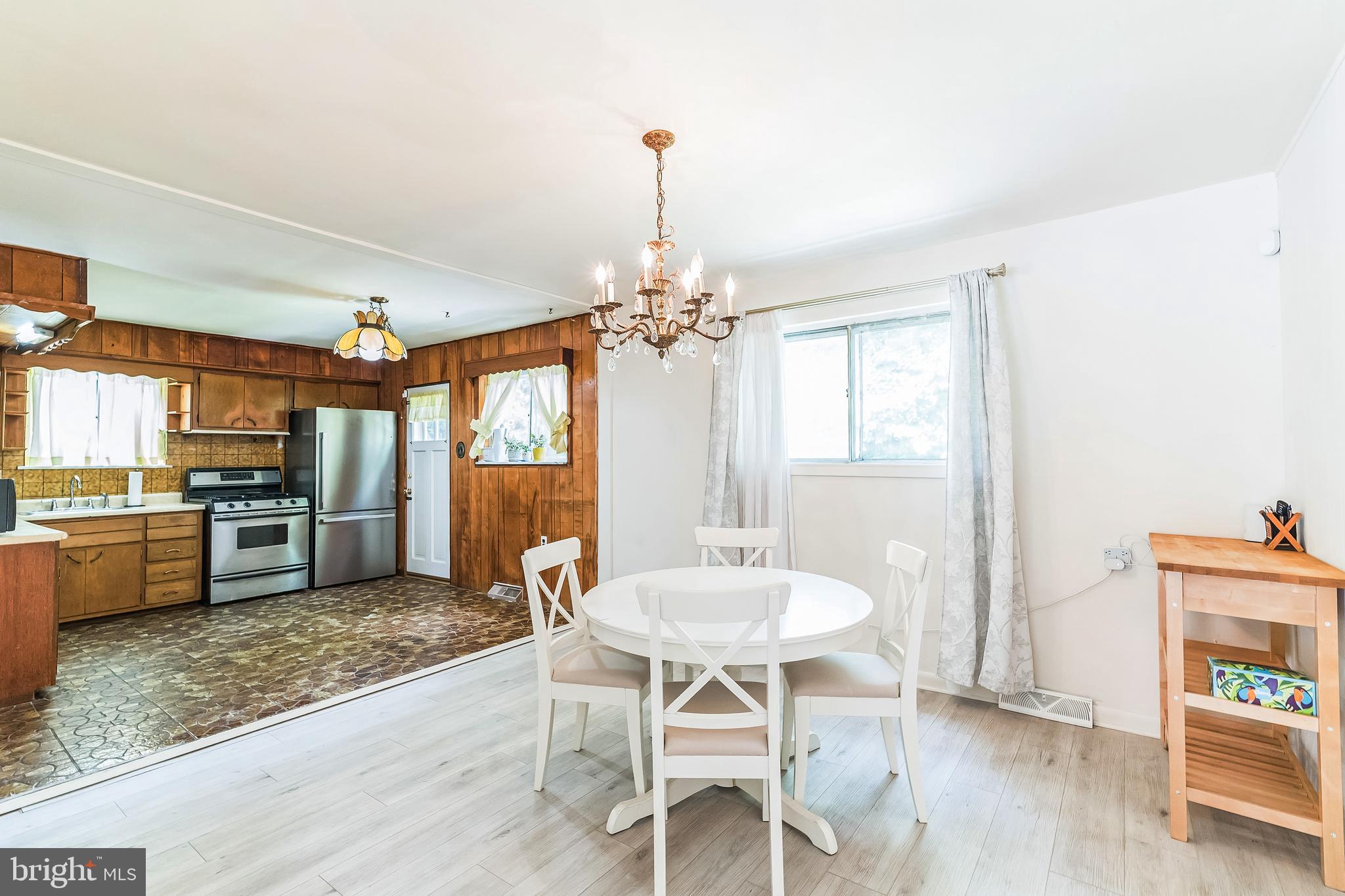 133 Lewis Road Havertown, PA 19083 - Photo 13 of 33 a view of a dining room with furniture window and wooden floor