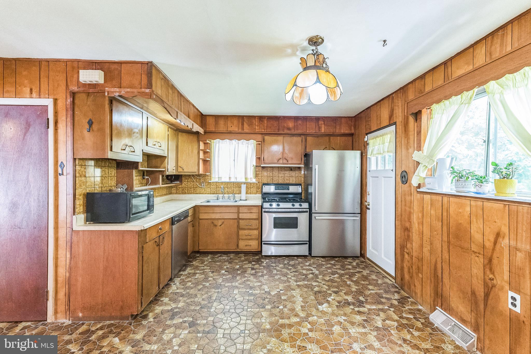 133 Lewis Road Havertown, PA 19083 - Photo 16 of 33 a kitchen with refrigerator cabinets and a stove