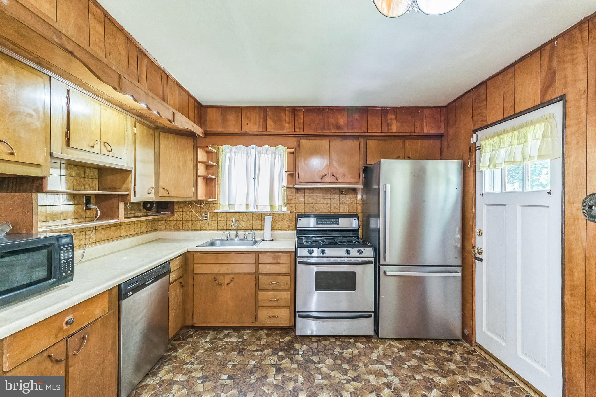 133 Lewis Road Havertown, PA 19083 - Photo 17 of 33 a kitchen with a refrigerator sink and stove